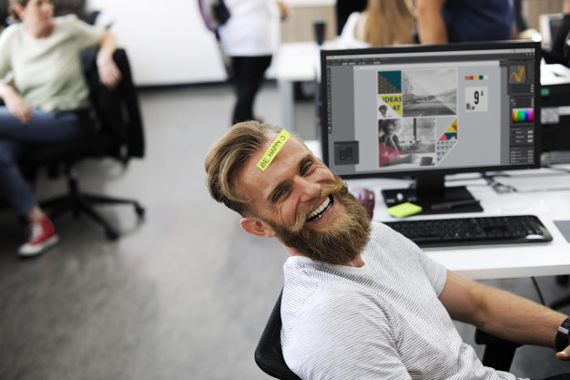 A happy beard man at office